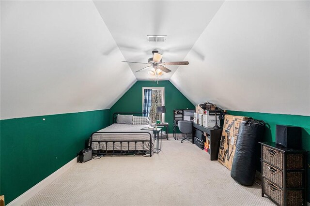 bedroom featuring lofted ceiling, ceiling fan, and carpet flooring