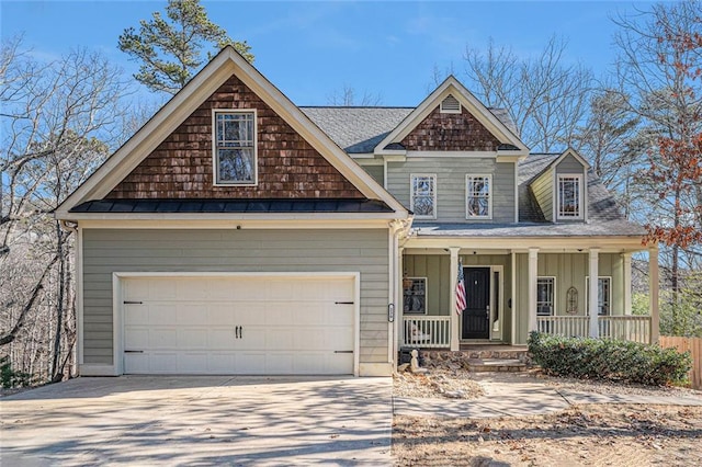 view of front facade featuring a porch and a garage