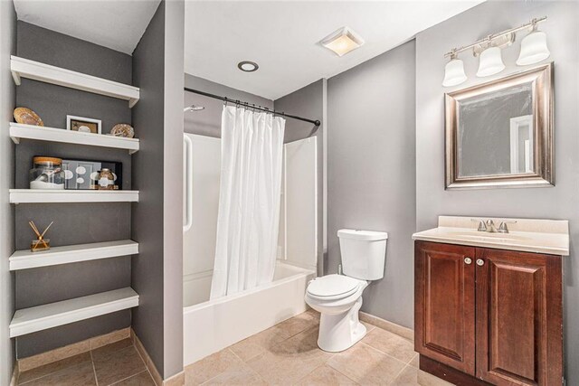 full bathroom with vanity, shower / bathtub combination with curtain, tile patterned floors, and toilet