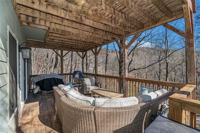 wooden terrace featuring an outdoor hangout area