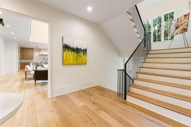 stairway featuring hardwood / wood-style flooring