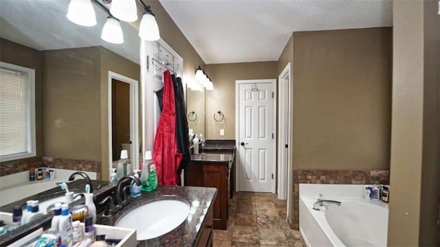 full bathroom with a bath and vanity