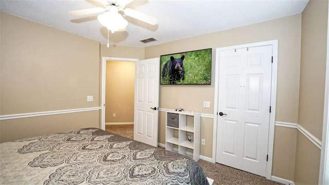 bedroom with carpet floors, baseboards, visible vents, and a ceiling fan