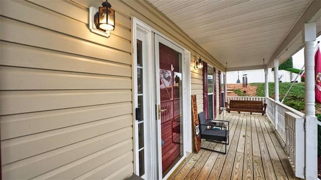 wooden terrace featuring a porch