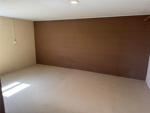 basement featuring concrete block wall