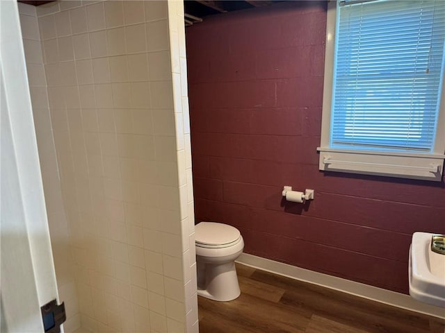 bathroom featuring toilet and wood finished floors