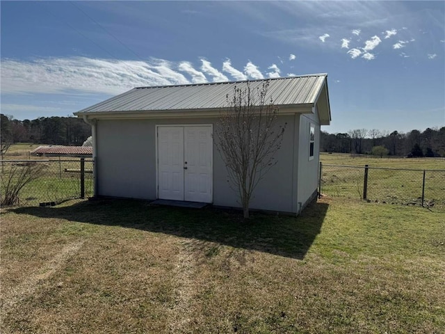 view of shed featuring fence