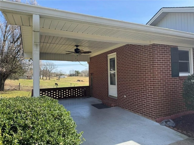 view of patio / terrace featuring an attached carport and ceiling fan