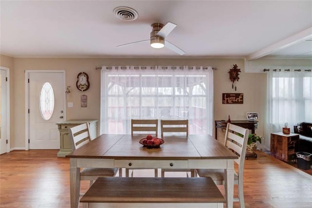 dining space featuring a wealth of natural light, ceiling fan, and light wood-type flooring