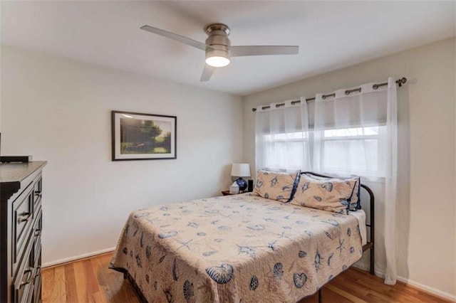 bedroom featuring light hardwood / wood-style flooring and ceiling fan