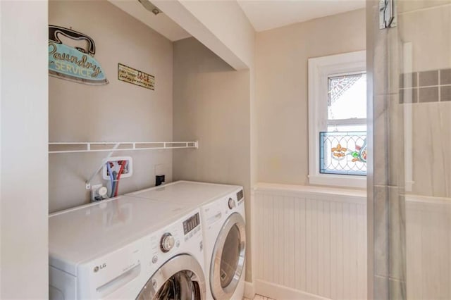 clothes washing area with washer and dryer