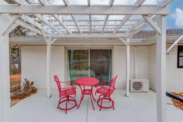 view of patio / terrace featuring a pergola and ac unit