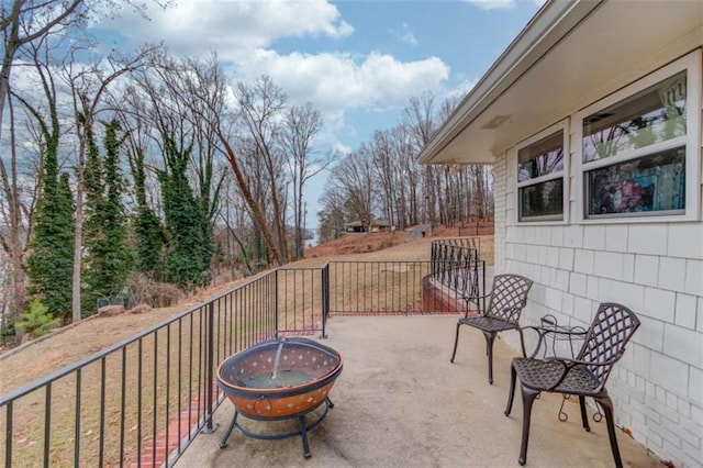 view of patio / terrace with a fire pit