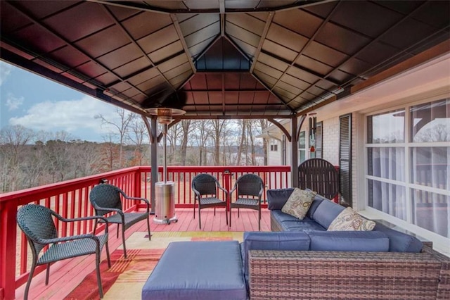 deck featuring a gazebo and an outdoor hangout area