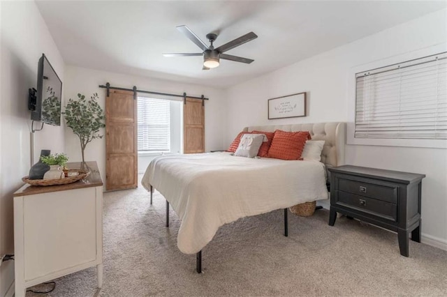 361 Princeton Way, Lawrenceville, GA 30044 - bedroom featuring light carpet, a barn door, and a ceiling fan