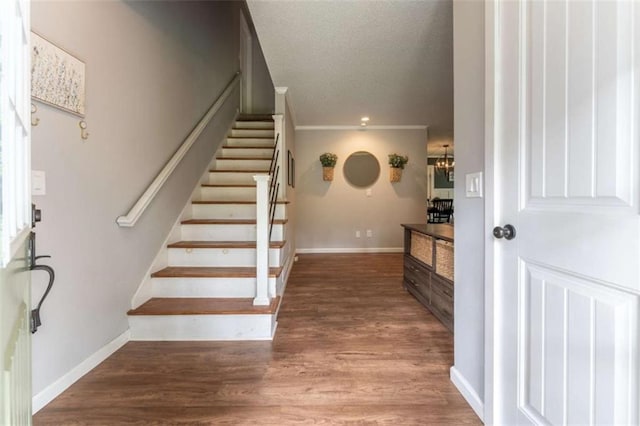 361 Princeton Way, Lawrenceville, GA 30044 - staircase featuring wood finished floors, a textured ceiling, and a chandelier