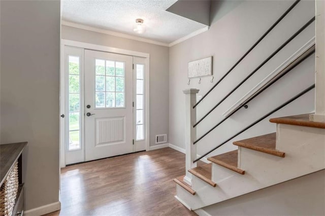 361 Princeton Way, Lawrenceville, GA 30044 - foyer with ornamental molding, stairs, wood finished floors, and a textured ceiling