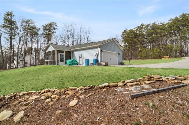 541 Mulberry Cir, Jasper, GA 30143 - rear view of property with a garage, a sunroom, and a yard