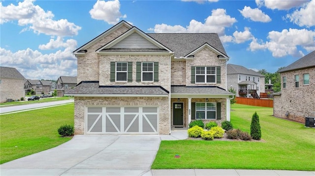 2090 Harvester Ln, Buford, GA 30518 - craftsman-style home with concrete driveway, an attached garage, a front lawn, brick siding, and a residential view