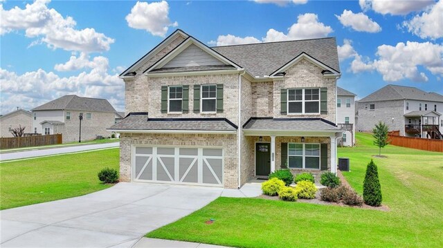 2090 Harvester Ln, Buford, GA 30518 - craftsman inspired home with brick siding, driveway, a garage, and a shingled roof