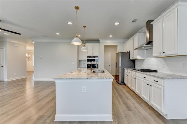 2090 Harvester Ln, Buford, GA 30518 - kitchen featuring wall chimney exhaust hood, freestanding refrigerator, ornamental molding, gas stovetop, and white cabinets