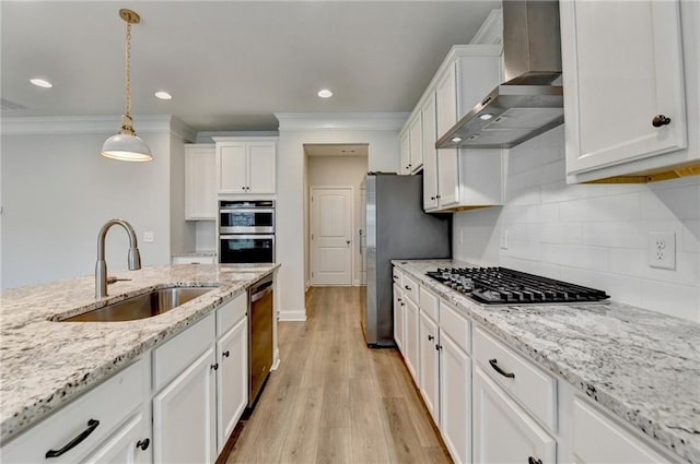 2090 Harvester Ln, Buford, GA 30518 - kitchen with wall chimney exhaust hood, appliances with stainless steel finishes, white cabinetry, ornamental molding, and pendant lighting