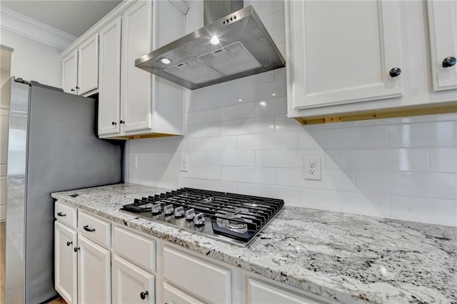 2090 Harvester Ln, Buford, GA 30518 - kitchen featuring wall chimney range hood, stainless steel appliances, white cabinets, crown molding, and tasteful backsplash