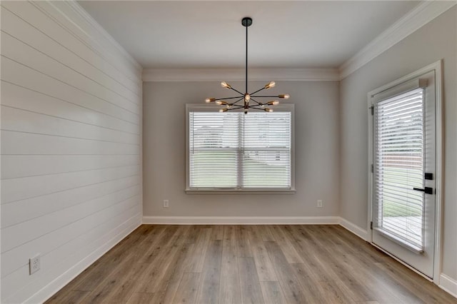 2090 Harvester Ln, Buford, GA 30518 - spare room featuring a chandelier, ornamental molding, and wood finished floors