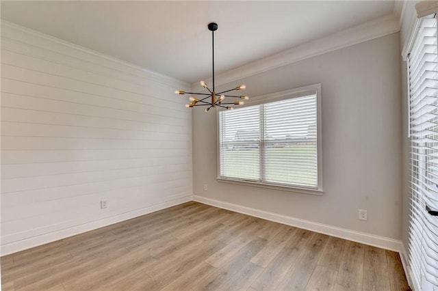 2090 Harvester Ln, Buford, GA 30518 - empty room featuring a chandelier, crown molding, and light wood-style flooring