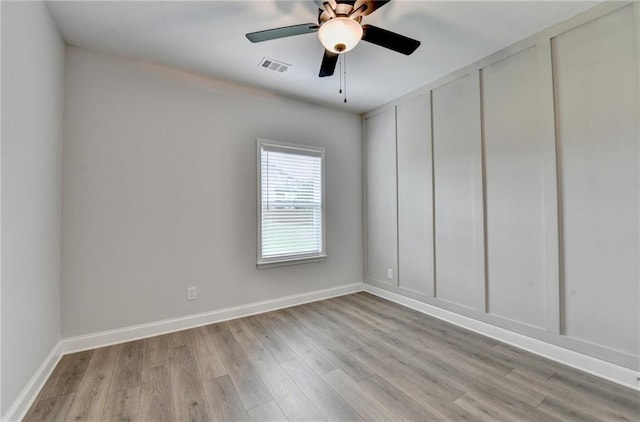 2090 Harvester Ln, Buford, GA 30518 - empty room featuring light wood-style floors and ceiling fan