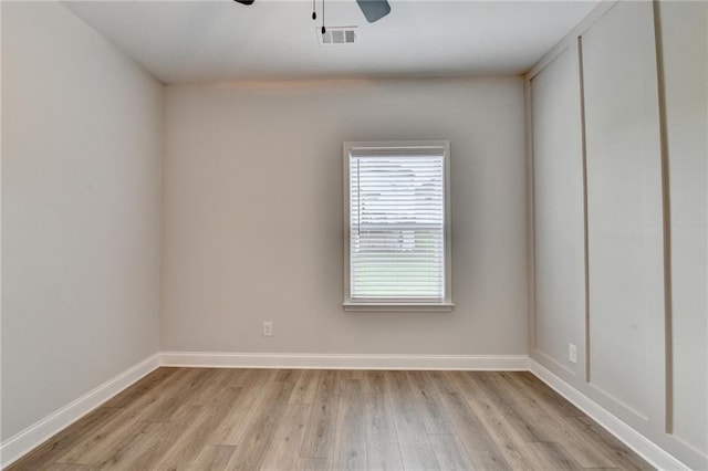 2090 Harvester Ln, Buford, GA 30518 - spare room with ceiling fan and light wood-style floors