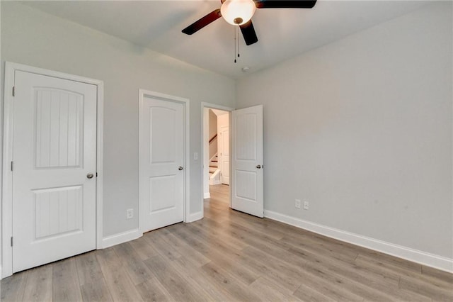 2090 Harvester Ln, Buford, GA 30518 - unfurnished bedroom with light wood-type flooring and a ceiling fan