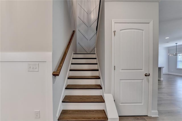 2090 Harvester Ln, Buford, GA 30518 - staircase with wood finished floors and baseboards