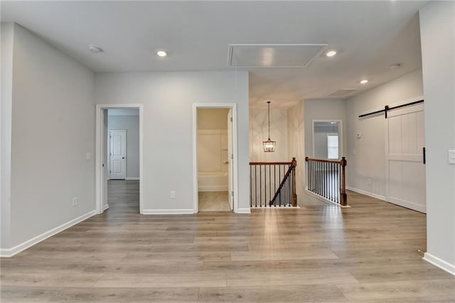 2090 Harvester Ln, Buford, GA 30518 - empty room featuring attic access, light wood-style flooring, and recessed lighting