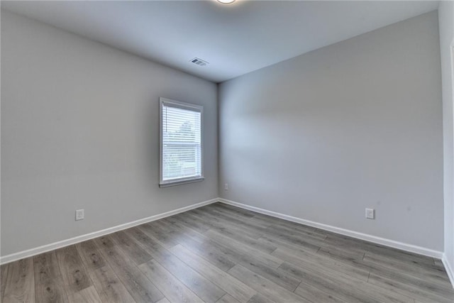 2090 Harvester Ln, Buford, GA 30518 - empty room featuring wood finished floors and baseboards