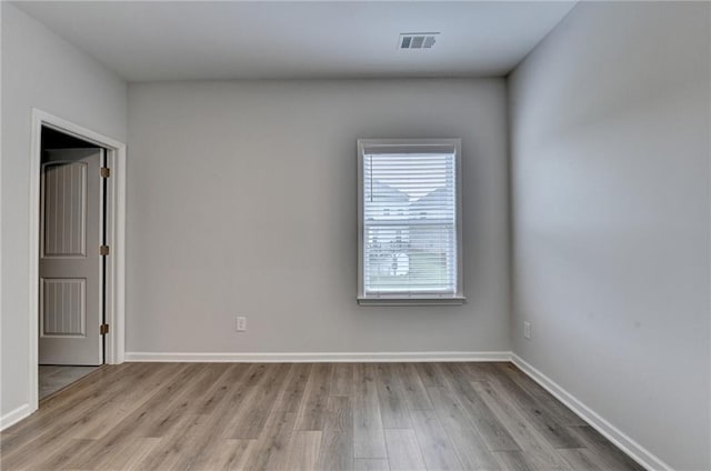 2090 Harvester Ln, Buford, GA 30518 - spare room featuring light wood finished floors and baseboards