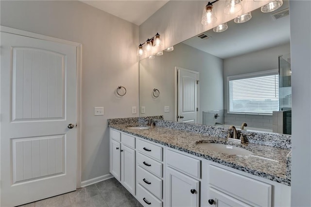 2090 Harvester Ln, Buford, GA 30518 - full bathroom with double vanity, a tile shower, and tile patterned floors