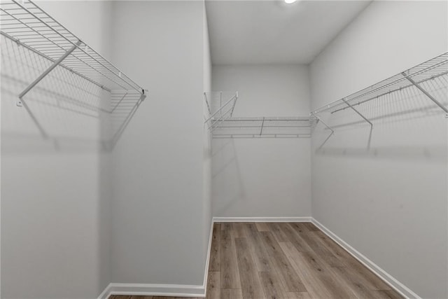 2090 Harvester Ln, Buford, GA 30518 - spacious closet with wood finished floors