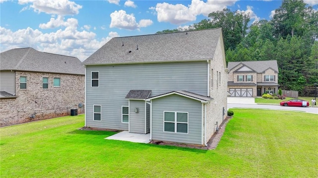 2090 Harvester Ln, Buford, GA 30518 - rear view of property with a lawn and roof with shingles