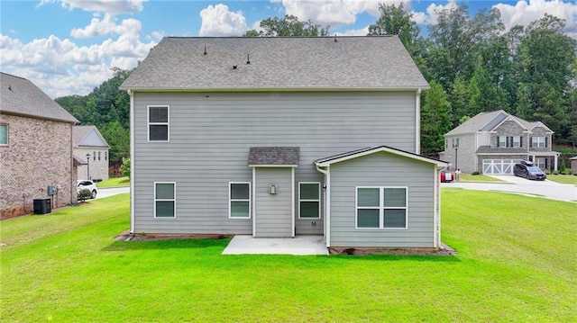 2090 Harvester Ln, Buford, GA 30518 - rear view of property featuring a lawn and a patio