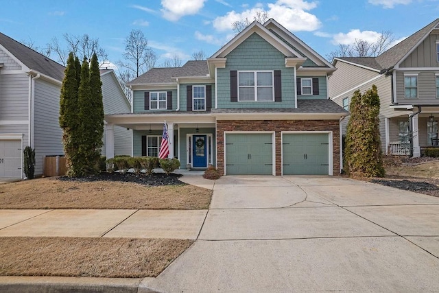 view of front of property featuring a garage and covered porch