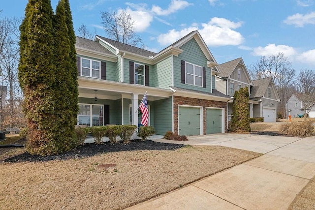 view of front of house with a porch, a garage, and central AC unit