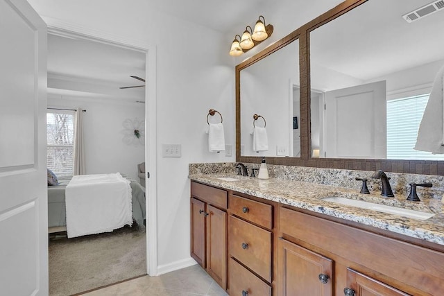 bathroom with tile patterned floors and vanity