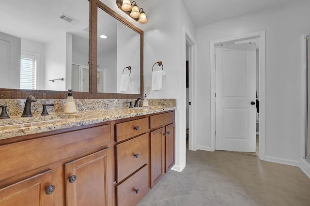 bathroom with vanity and tile patterned flooring