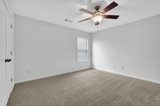 unfurnished room featuring ceiling fan and carpet floors