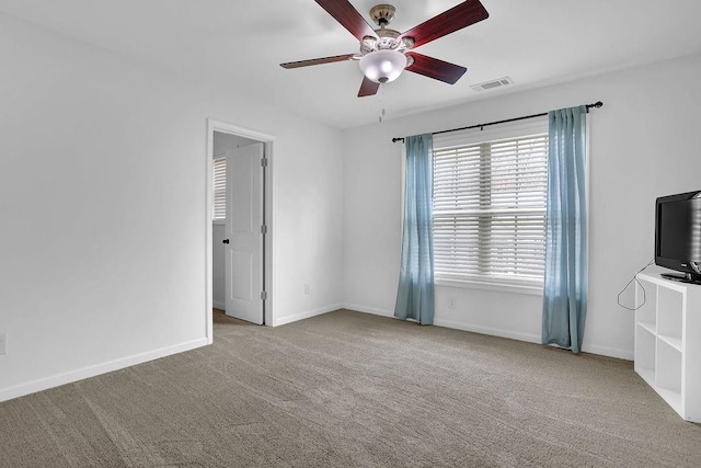 interior space with light colored carpet and ceiling fan