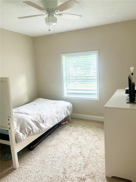 4567 Duncan Dr, Sugar Hill, GA 30518 - bathroom with vanity, toilet, and baseboards