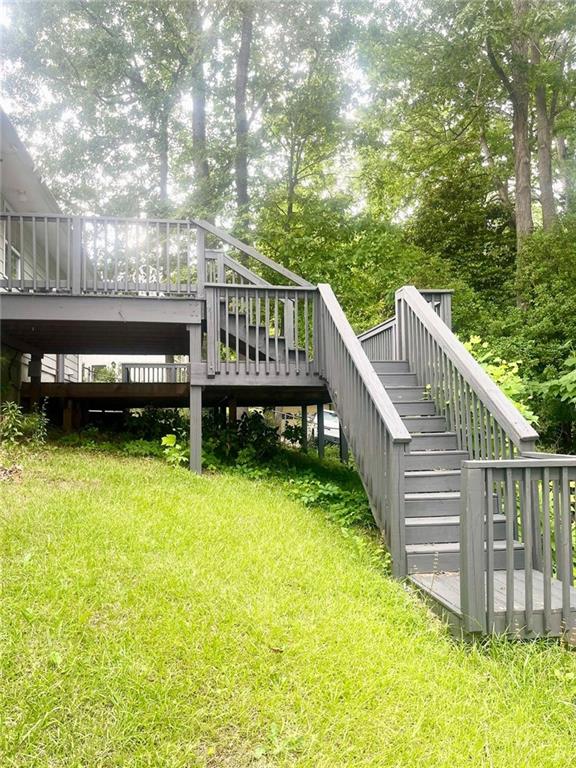 4567 Duncan Dr, Sugar Hill, GA 30518 - ranch-style house with covered porch, a front yard, and an attached garage