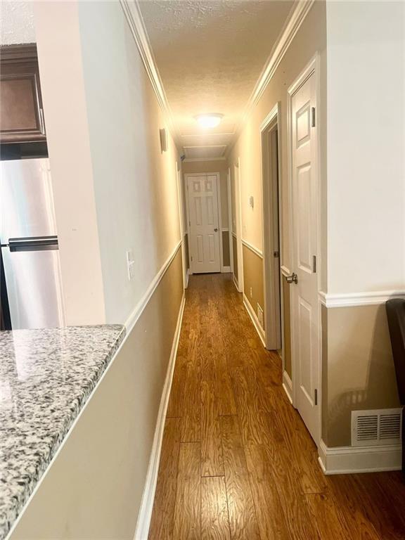 4567 Duncan Dr, Sugar Hill, GA 30518 - kitchen featuring appliances with stainless steel finishes, tasteful backsplash, a chandelier, a textured ceiling, and light tile patterned flooring
