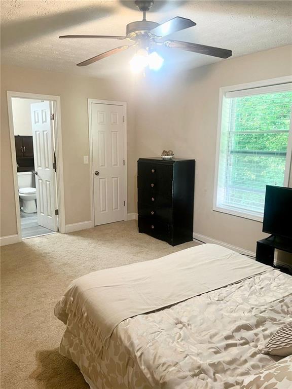 4567 Duncan Dr, Sugar Hill, GA 30518 - unfurnished room featuring a ceiling fan, baseboards, and carpet flooring